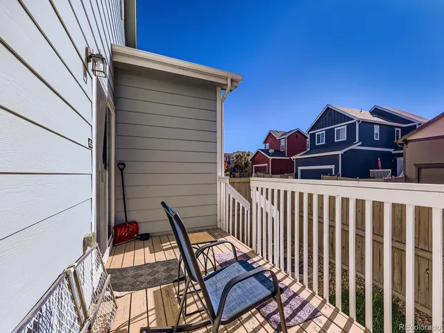 a view of a wooden chairs on the deck
