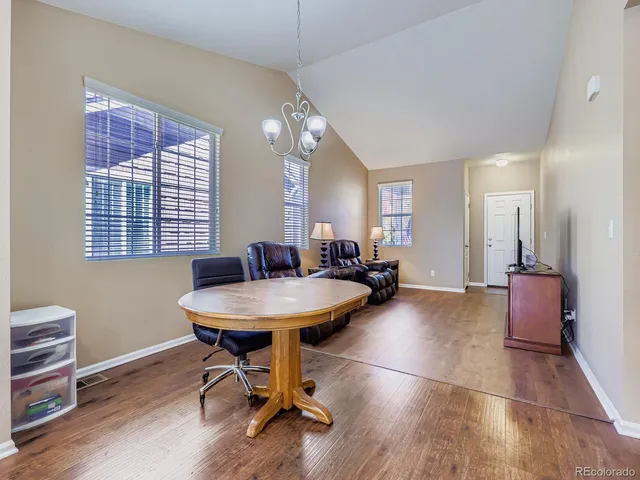 a view of a livingroom with furniture and a table