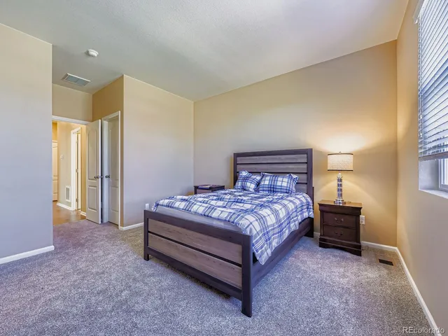 a view of a wooden house with a yard