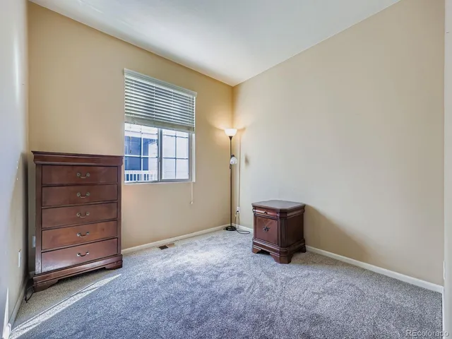 a view of an empty room and dresser