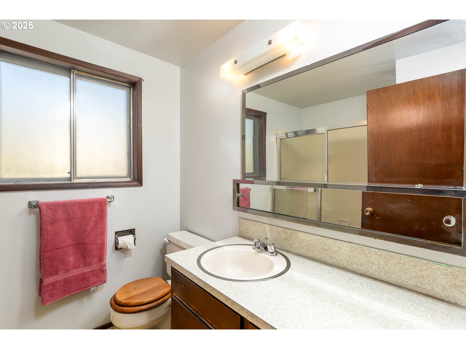 47711 Commercial Street Oakridge, OR 97463 - Photo 14 of 32 a bathroom with a sink a toilet and mirror