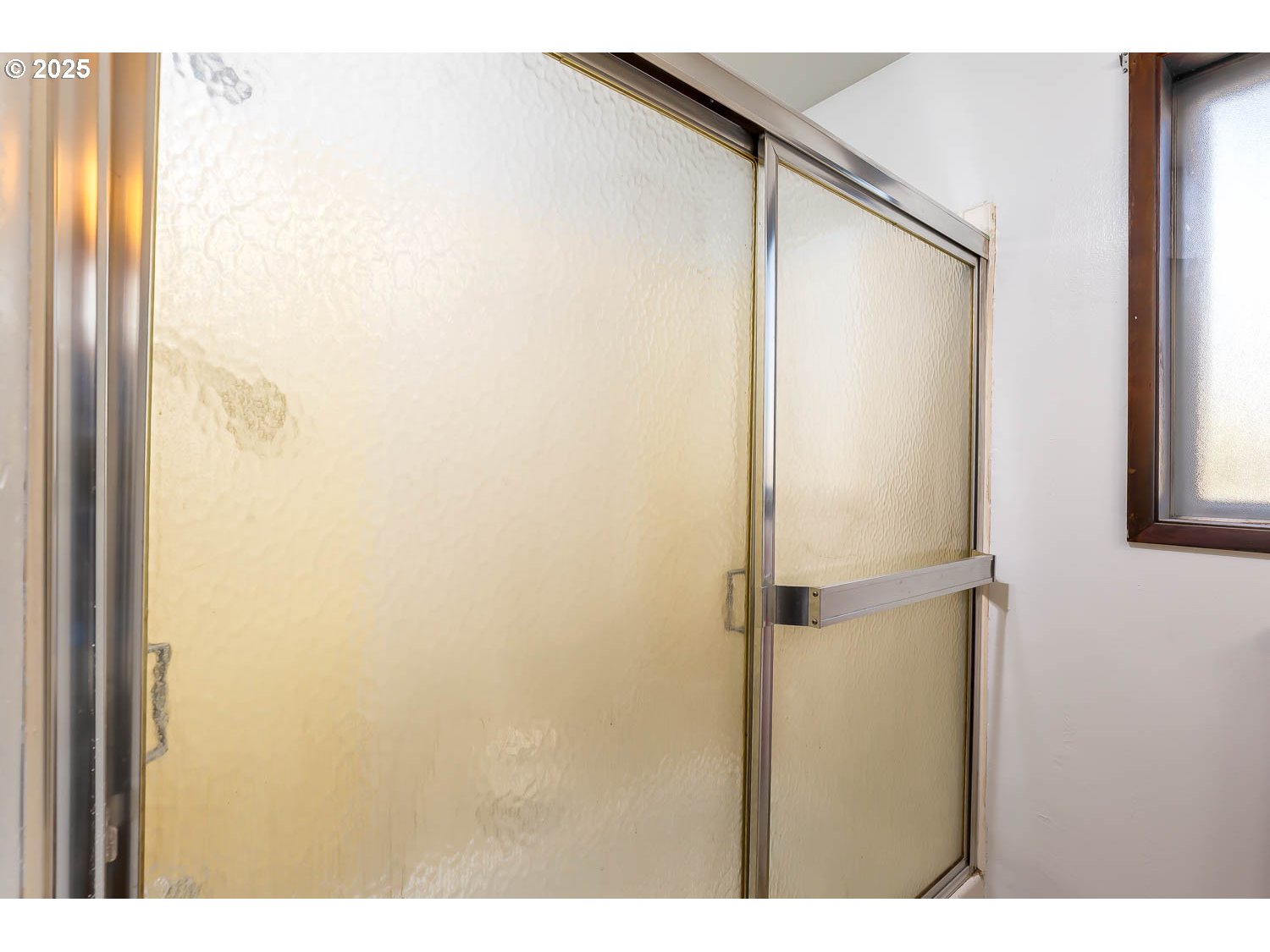 47711 Commercial Street Oakridge, OR 97463 - Photo 15 of 32 a bathroom with a glass shower door