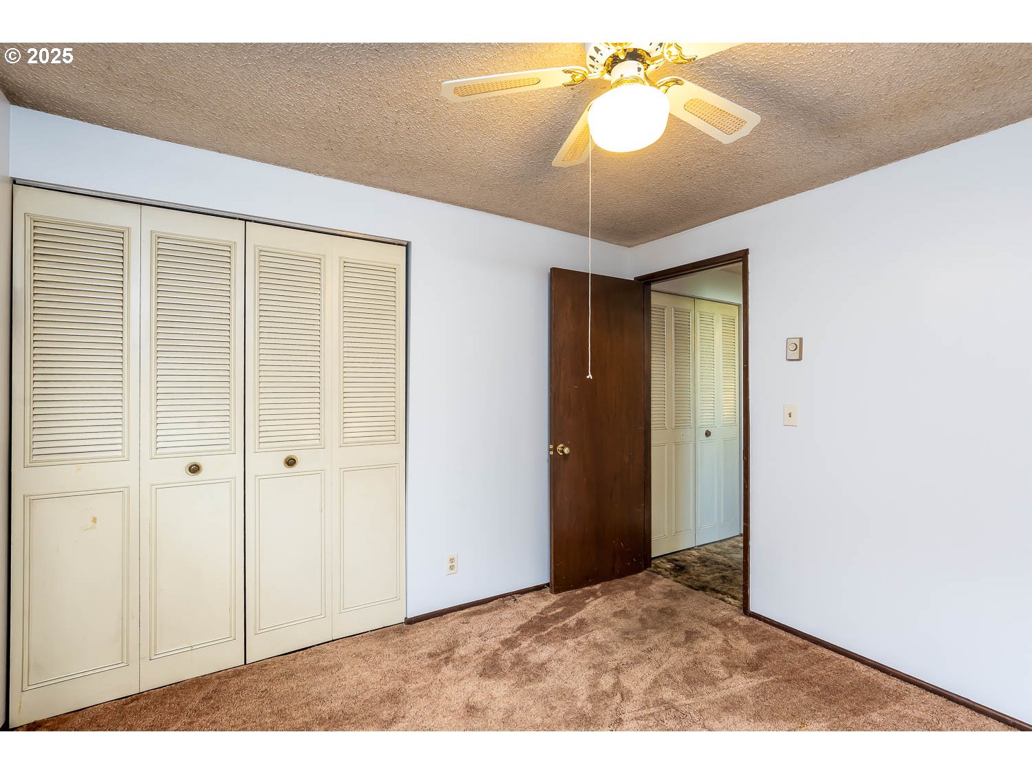 47711 Commercial Street Oakridge, OR 97463 - Photo 17 of 32 a view of empty room with a chandelier fan