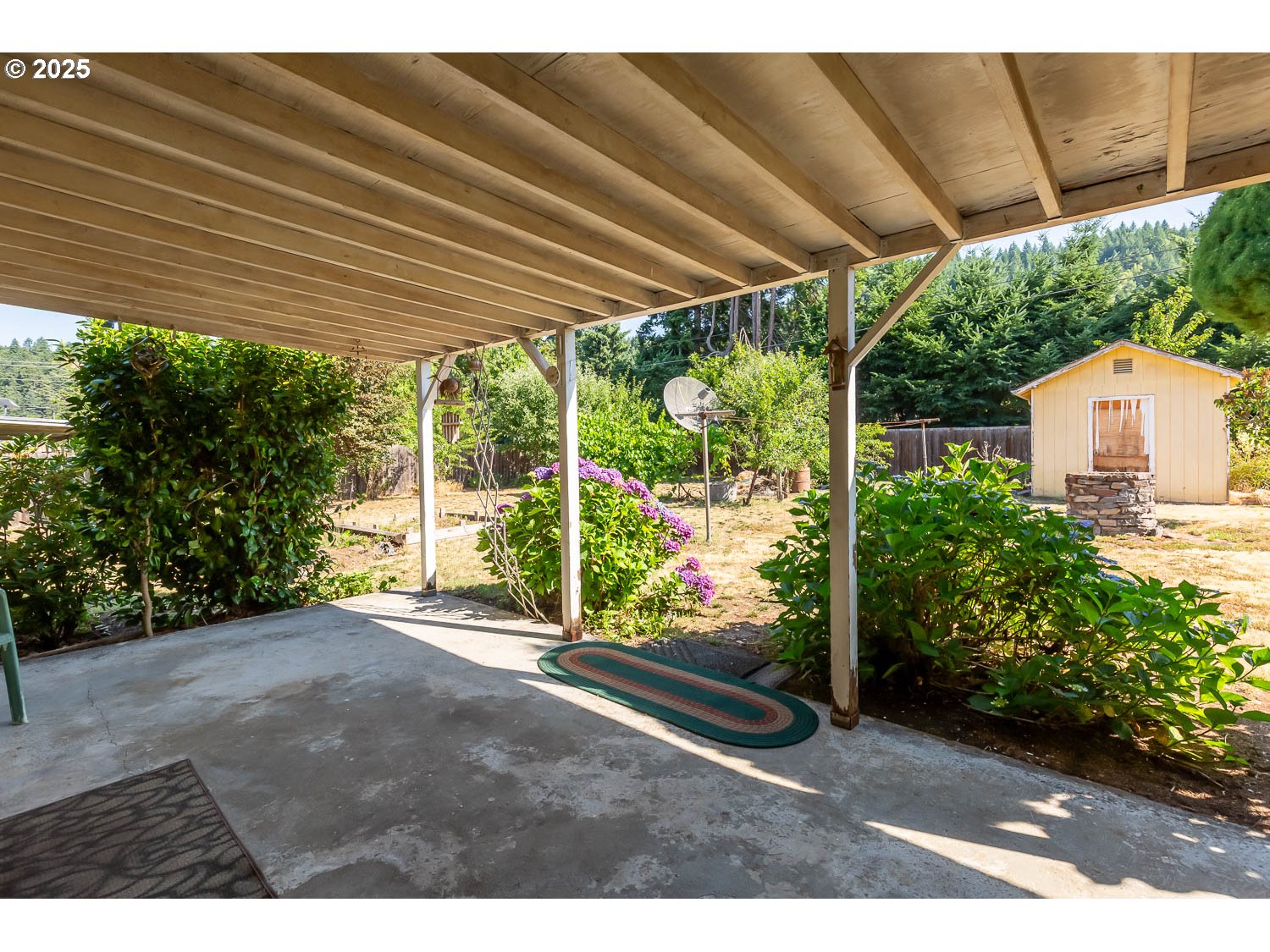 47711 Commercial Street Oakridge, OR 97463 - Photo 25 of 32 a view of a backyard with garden