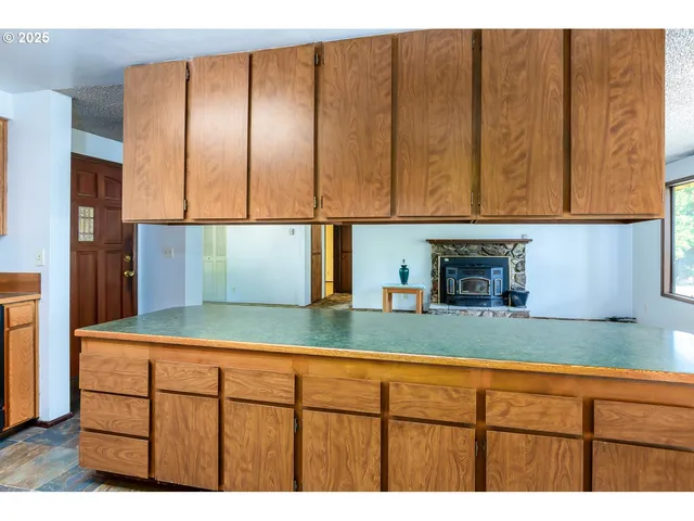 a kitchen with sink cabinets and a refrigerator