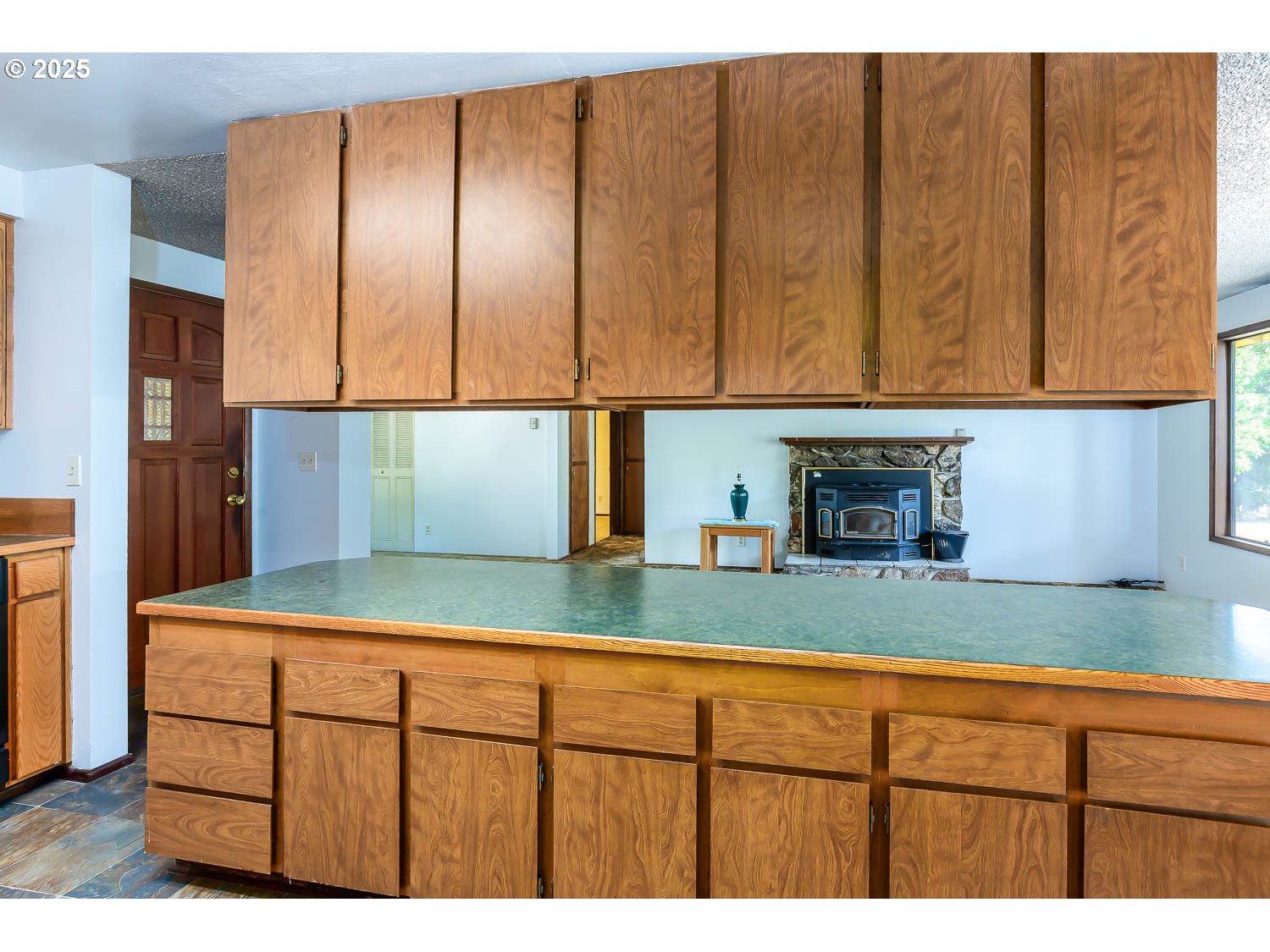 47711 Commercial Street Oakridge, OR 97463 - Photo 7 of 32 a kitchen with sink cabinets and a refrigerator