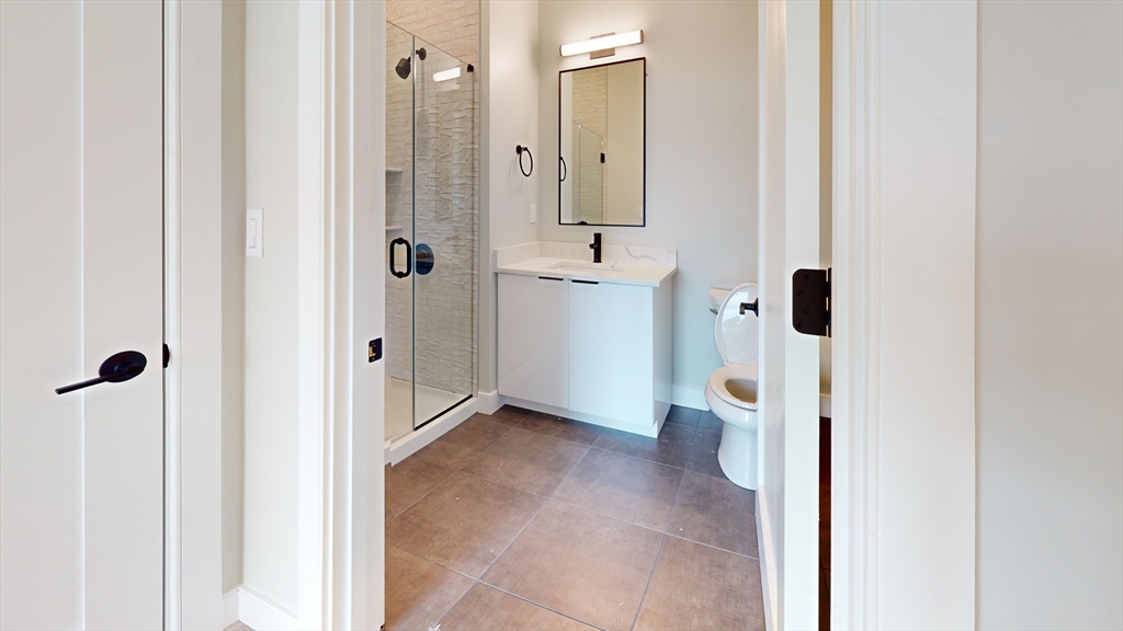 211 Green Street, Unit 508 Boston, MA 02130 - Photo 5 of 11 a view of a bathroom with a shower