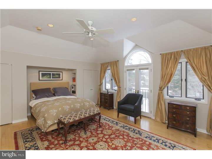 22 Wilson Road Princeton, NJ 08540 - Photo 18 of 25 a living room with furniture a fireplace and a chandelier