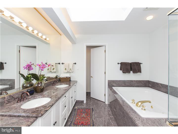 22 Wilson Road Princeton, NJ 08540 - Photo 19 of 25 a bathroom with a granite countertop sink a mirror and a bathtub