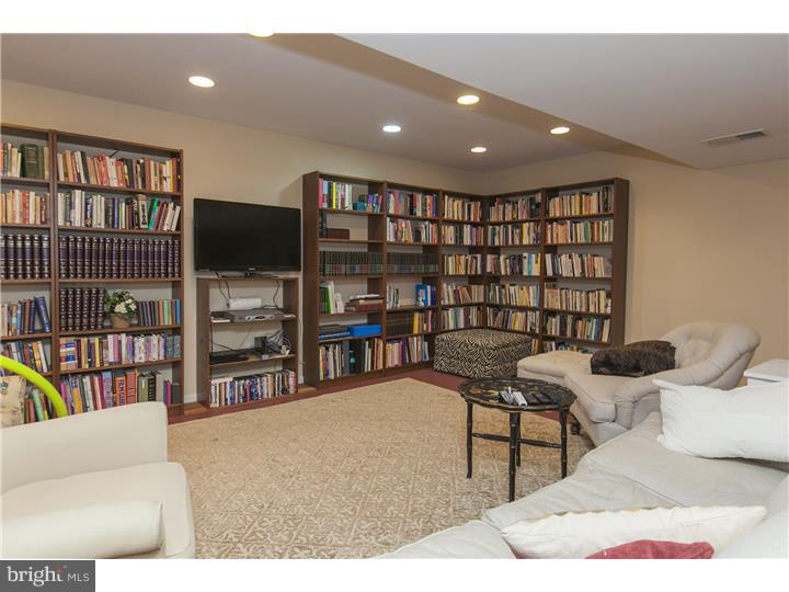 22 Wilson Road Princeton, NJ 08540 - Photo 24 of 25 a living room with furniture and a flat screen tv
