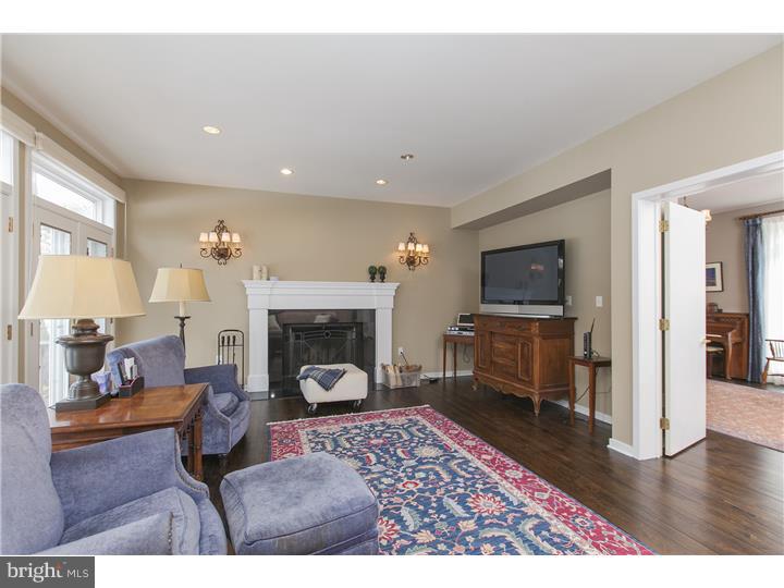 22 Wilson Road Princeton, NJ 08540 - Photo 6 of 25 a living room with furniture a fireplace and a flat screen tv