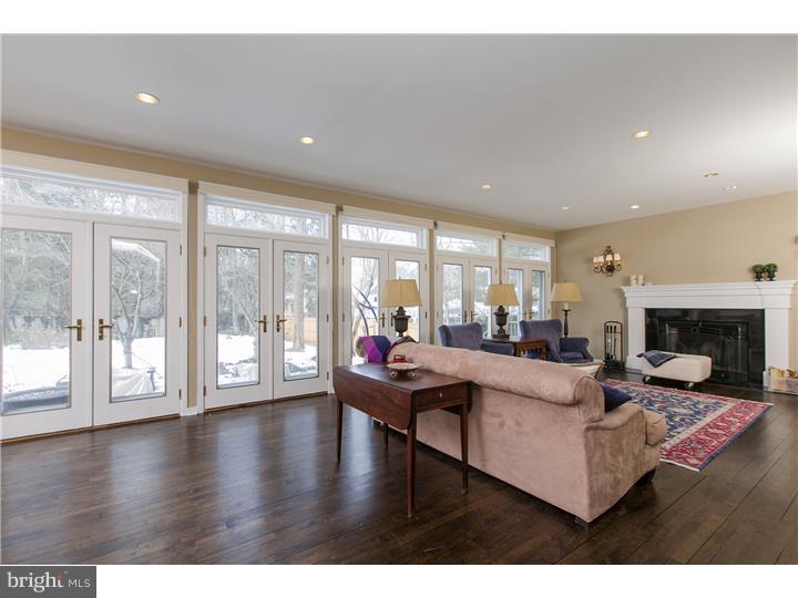 22 Wilson Road Princeton, NJ 08540 - Photo 8 of 25 a living room with fireplace furniture and a large window