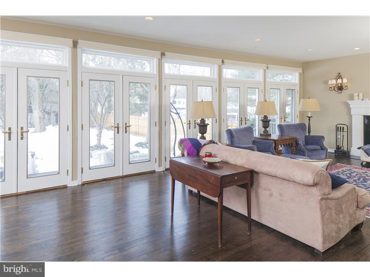 22 Wilson Road Princeton, NJ 08540 - Photo 10 of 25 a living room with furniture large windows and wooden floor