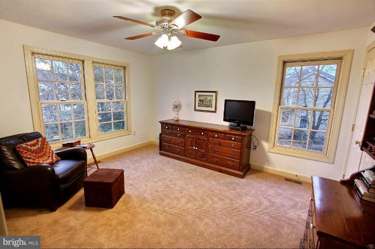 20003 Hickman Way Poolesville, MD 20837 - Photo 1 of 30 a living room with furniture and a flat screen tv