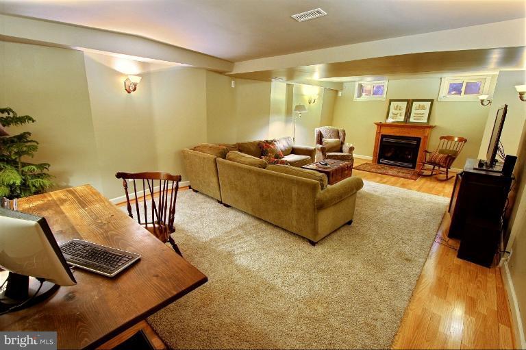 20003 Hickman Way Poolesville, MD 20837 - Photo 14 of 30 a living room with furniture and a flat screen tv