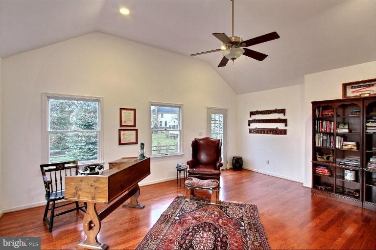 20003 Hickman Way Poolesville, MD 20837 - Photo 19 of 30 a living room with furniture a window and a flat screen tv