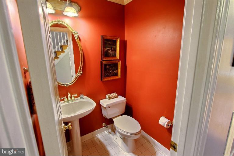 20003 Hickman Way Poolesville, MD 20837 - Photo 29 of 30 a bathroom with a toilet and a mirror