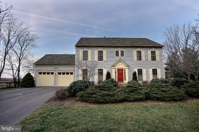 20003 Hickman Way Poolesville, MD 20837 - Photo 30 of 30 a front view of a house with a yard and garage