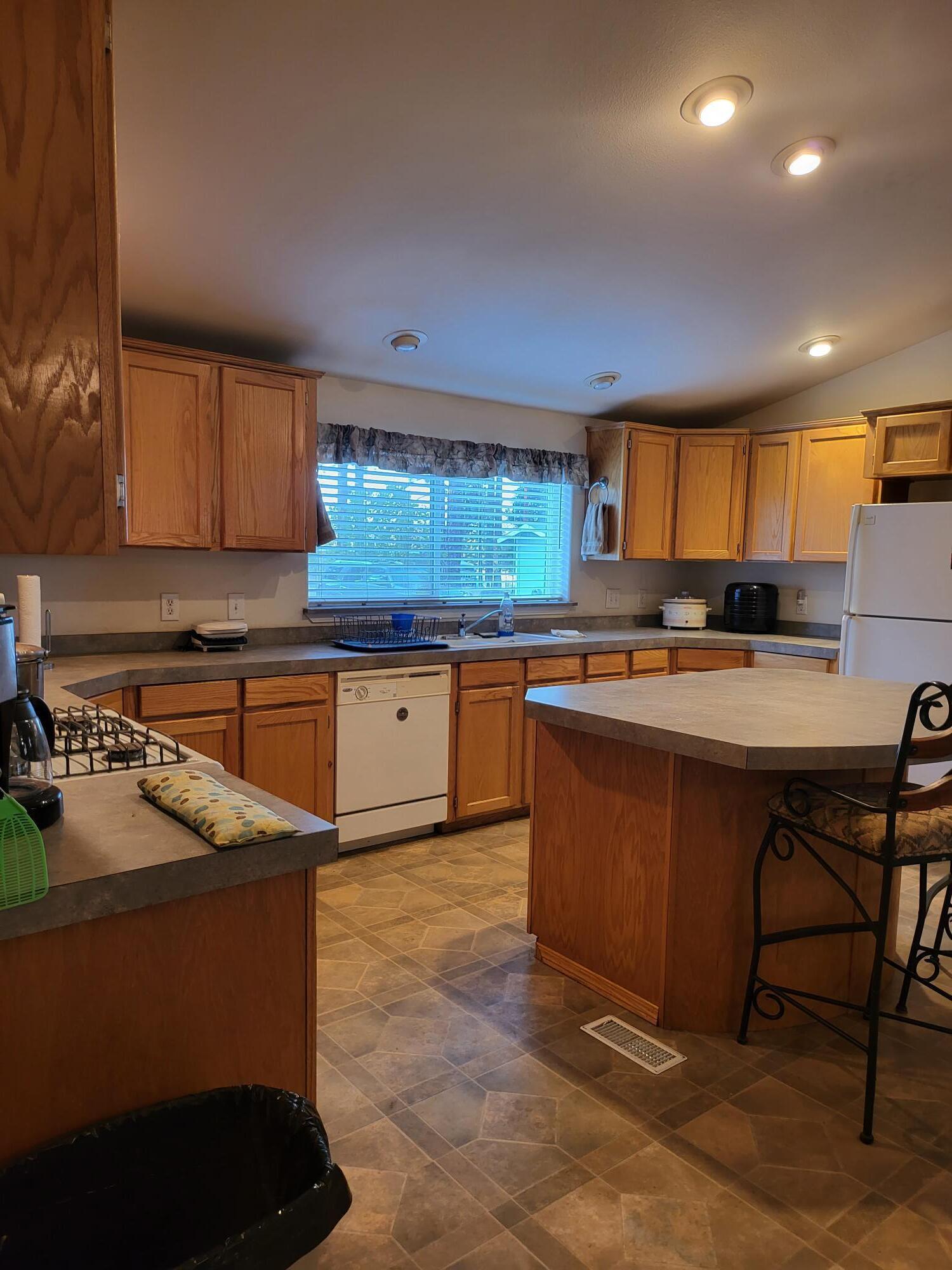 31 Juniper Way McArthur, CA 96056 - Photo 5 of 24 a kitchen with stainless steel appliances granite countertop a sink stove and cabinets