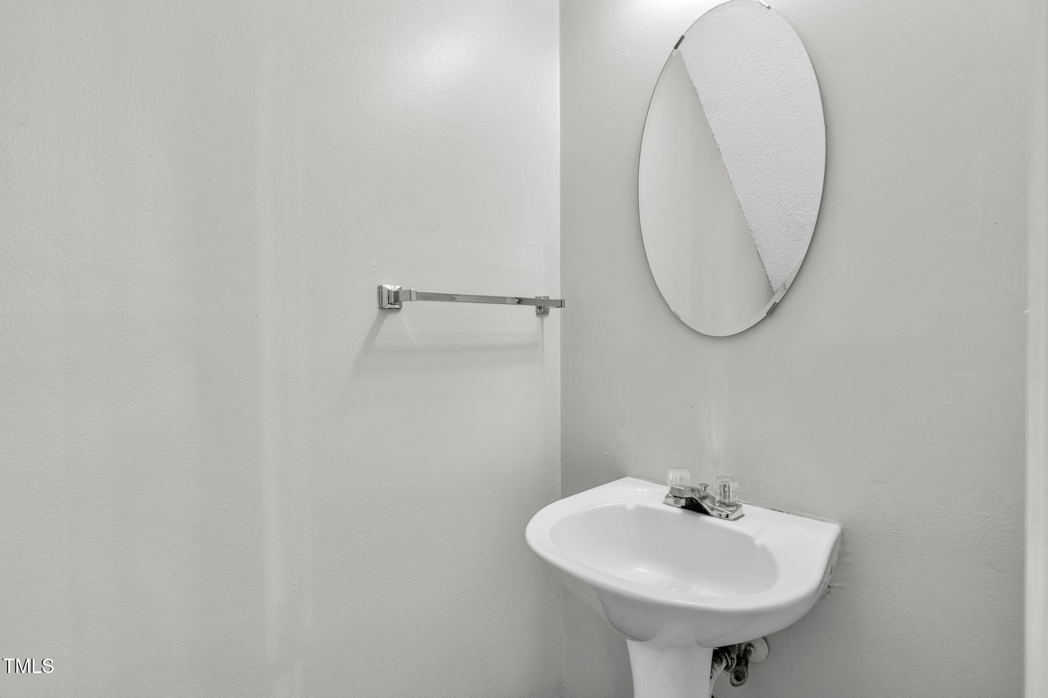 8117 Farmlea Circle Raleigh, NC 27616 - Photo 10 of 20 a bathroom with a sink a mirror and a shower