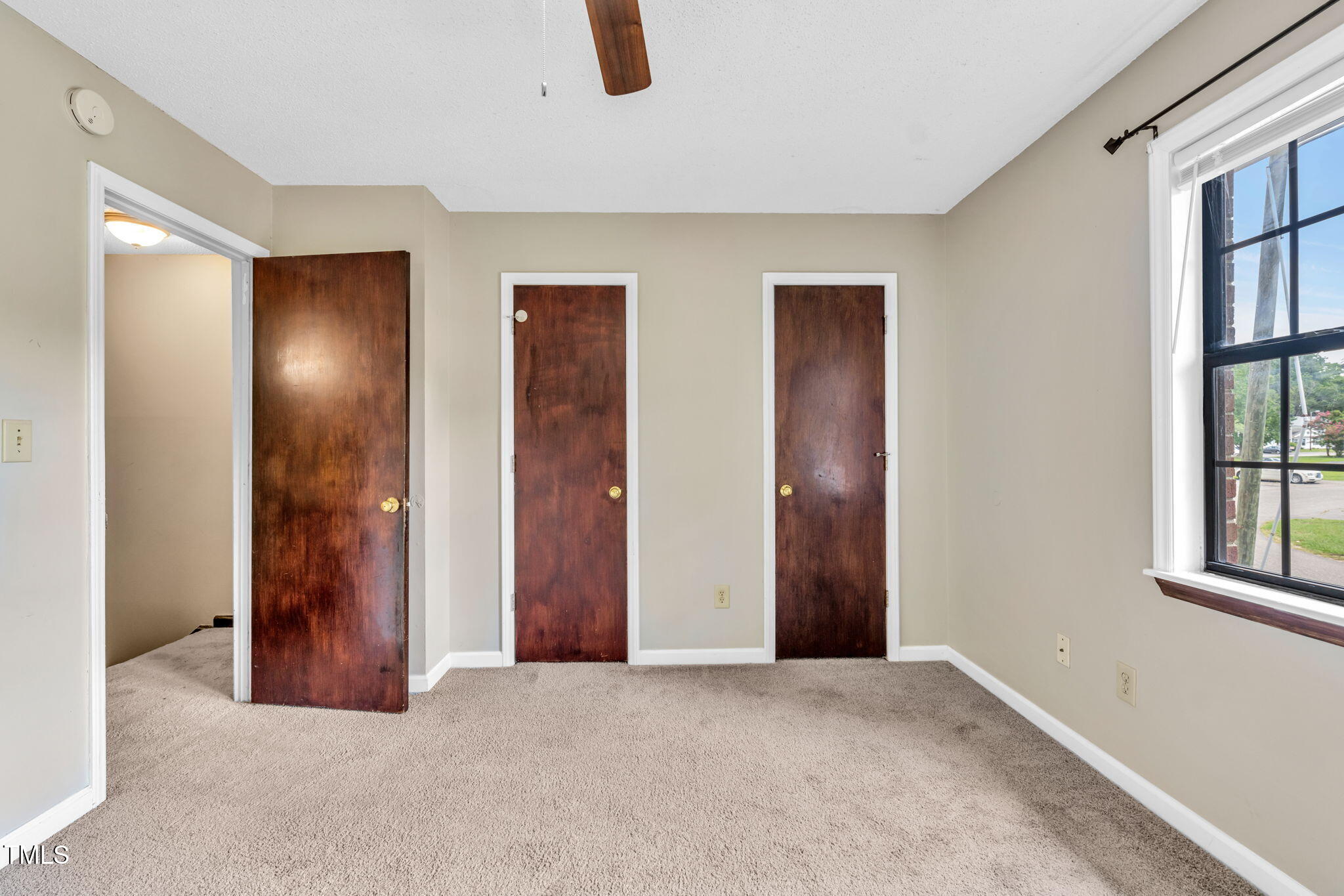 8117 Farmlea Circle Raleigh, NC 27616 - Photo 12 of 20 an empty room with windows and closet
