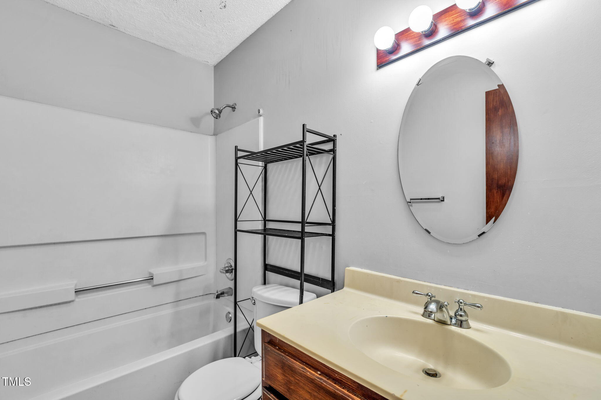 8117 Farmlea Circle Raleigh, NC 27616 - Photo 14 of 20 a bathroom with a sink toilet and shower