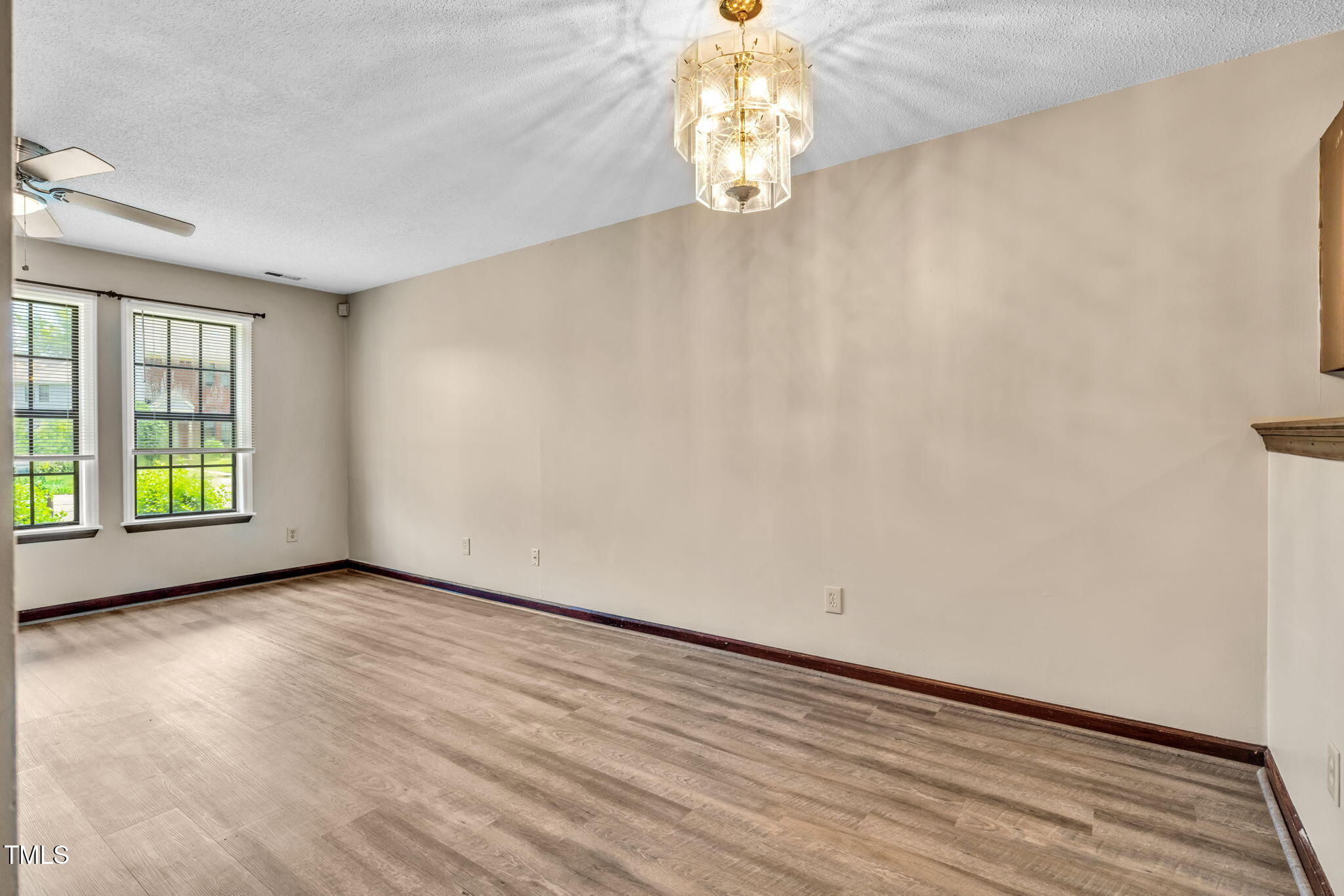 8117 Farmlea Circle Raleigh, NC 27616 - Photo 6 of 20 a view of an empty room and window