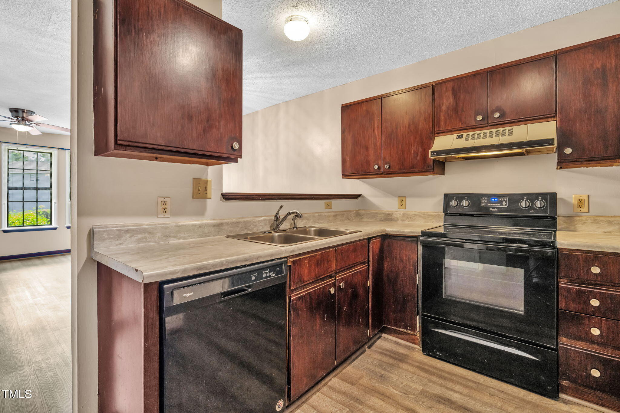 8117 Farmlea Circle Raleigh, NC 27616 - Photo 7 of 20 a kitchen with stainless steel appliances granite countertop a stove a sink and a microwave