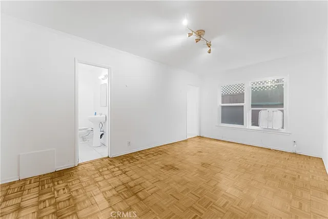 a view of an empty room with a window