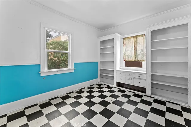 a room with a black white checkered floor with a black white checkered floor
