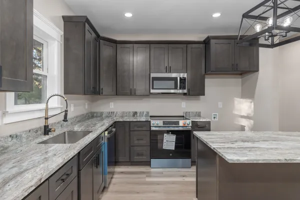 a front view of a house with a garden