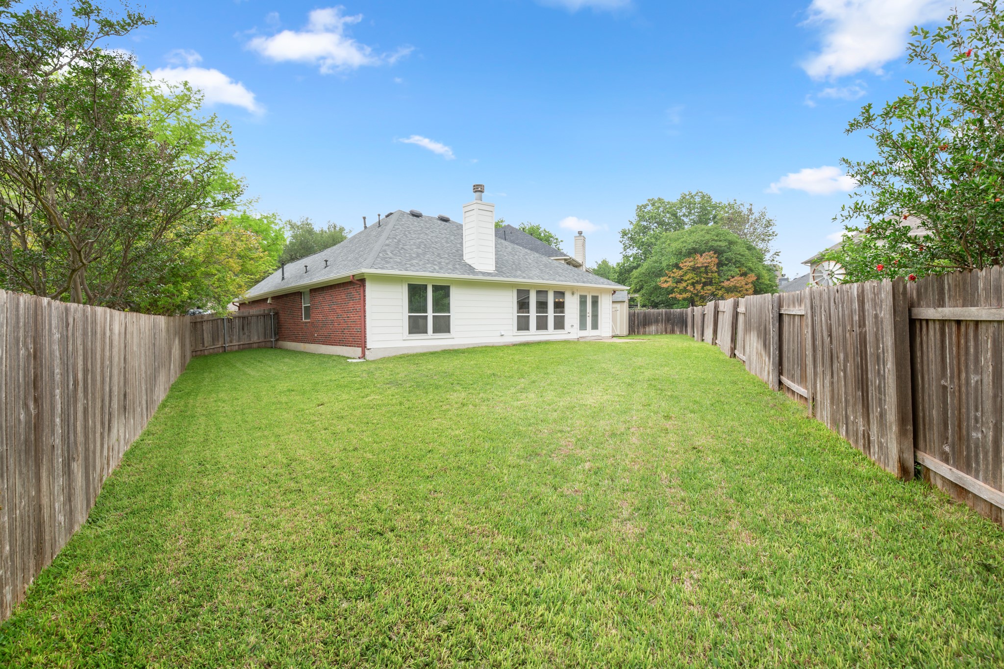 3420 Ribbon Reef Lane Austin, TX 78728 - Photo 23 of 25 Backyard with full sprinkler system, privacy fence