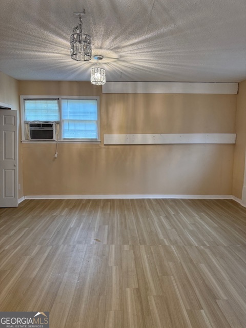 317 Emory Drive Warner Robins, GA 31093 - Photo 11 of 28 a view of a room with kitchen island stainless steel appliances wooden floor and window