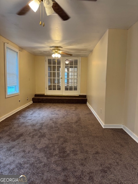 317 Emory Drive Warner Robins, GA 31093 - Photo 15 of 28 an empty room with windows and fan