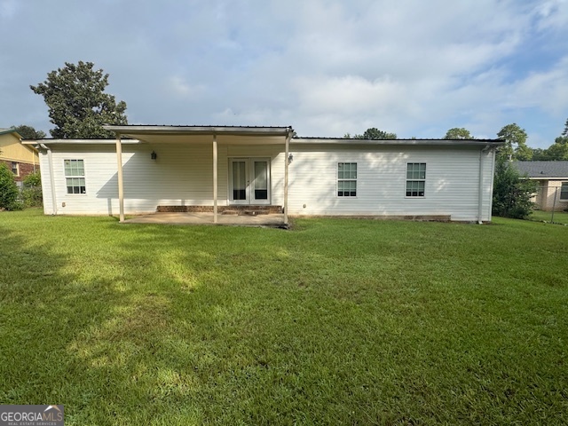 317 Emory Drive Warner Robins, GA 31093 - Photo 25 of 28 a front view of house with yard and trees in the background