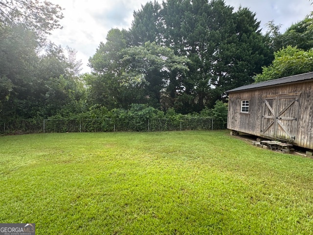 317 Emory Drive Warner Robins, GA 31093 - Photo 27 of 28 a view of a backyard with a garden