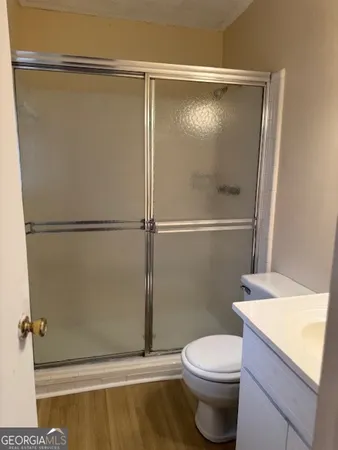 a bathroom with a shower and a toilet