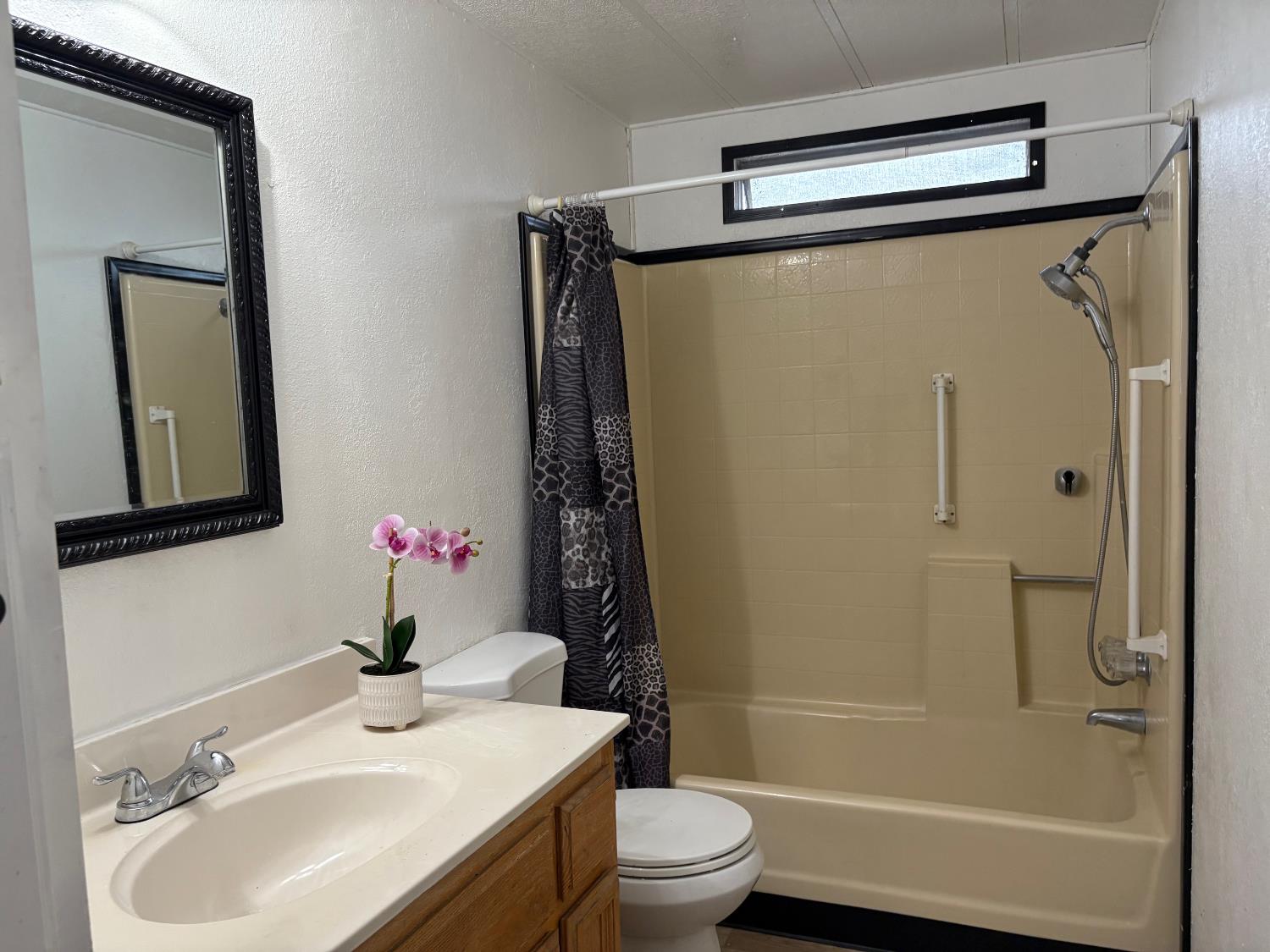 165 Hanover Street Citrus Heights, CA 95621 - Photo 5 of 10 a bathroom with a sink toilet and shower