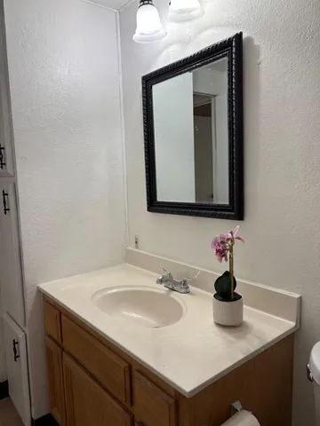 a bathroom with sink and mirror