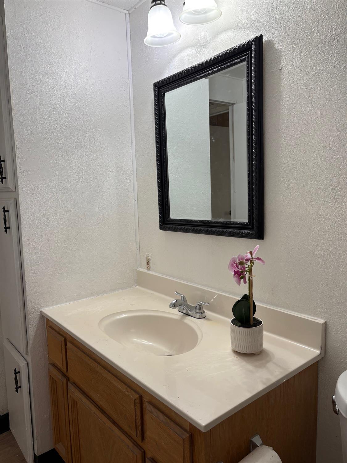165 Hanover Street Citrus Heights, CA 95621 - Photo 6 of 10 a bathroom with sink and mirror