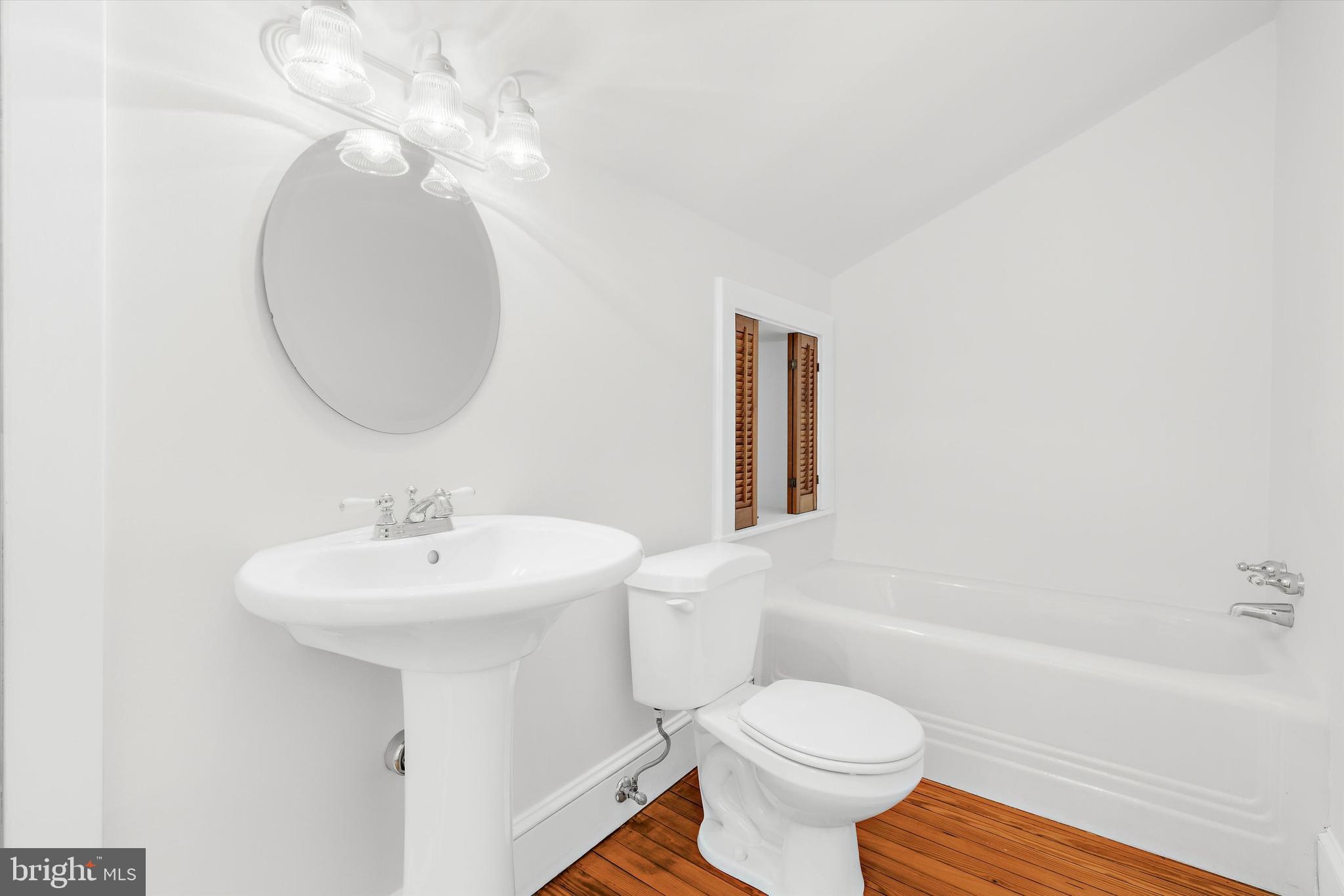 500 Nesbit Road Queenstown, MD 21658 - Photo 35 of 53 a bathroom with a sink a toilet and a mirror