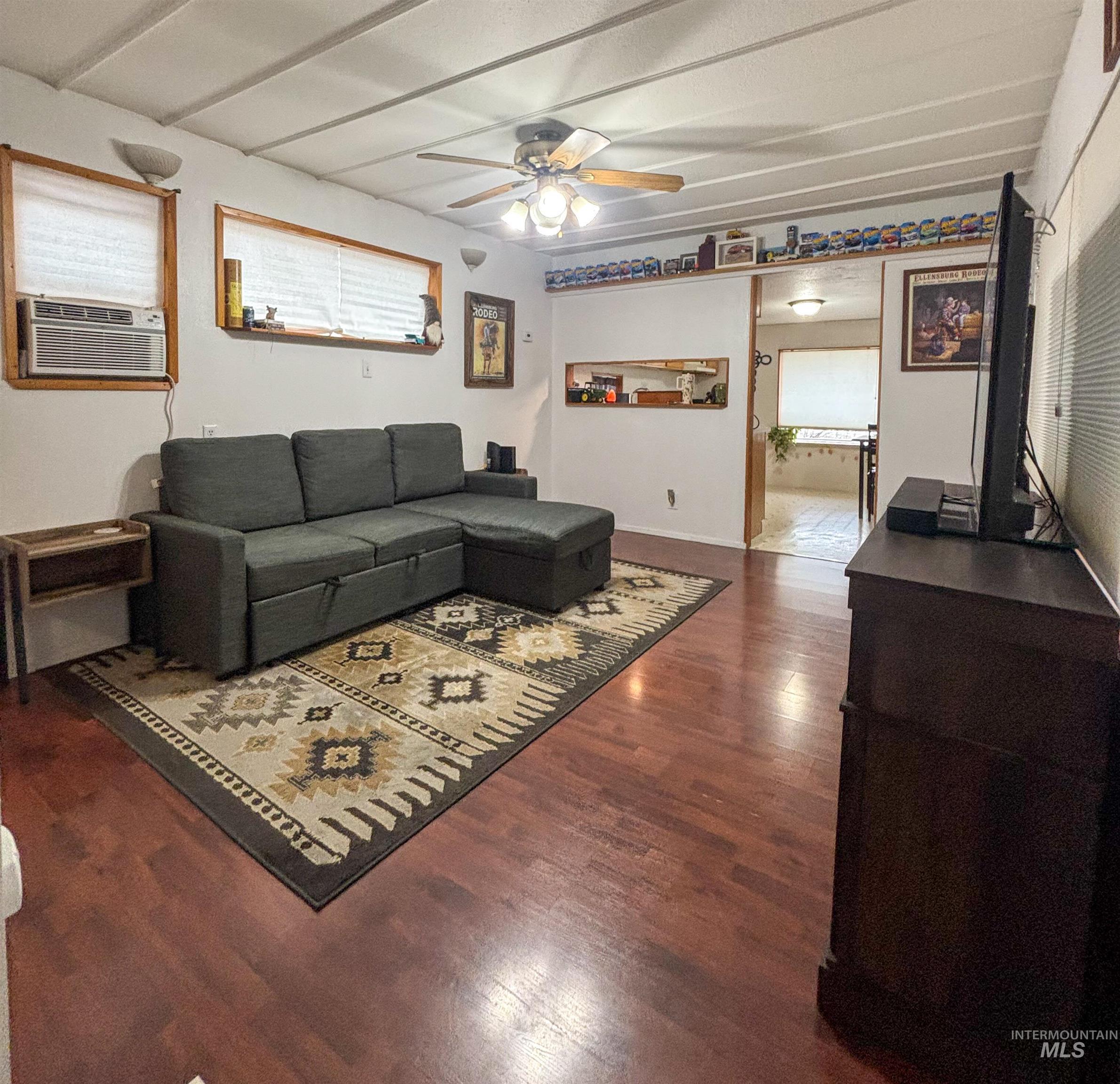 2280 Old Pullman Road, Unit 20 Moscow, ID 83843 - Photo 5 of 20 Living area with a ceiling fan, cooling unit, and dark wood-style flooring