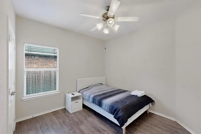 a bedroom with a bed and window