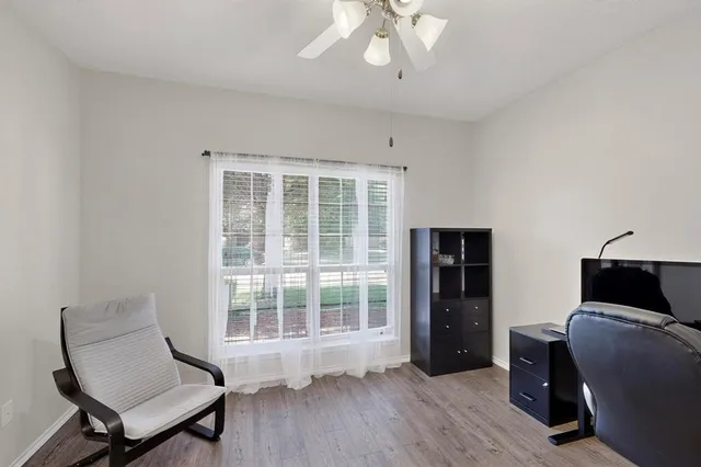 a living room with furniture and a window