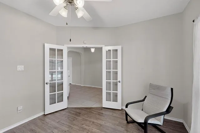 a view of a room with furniture and wooden floor