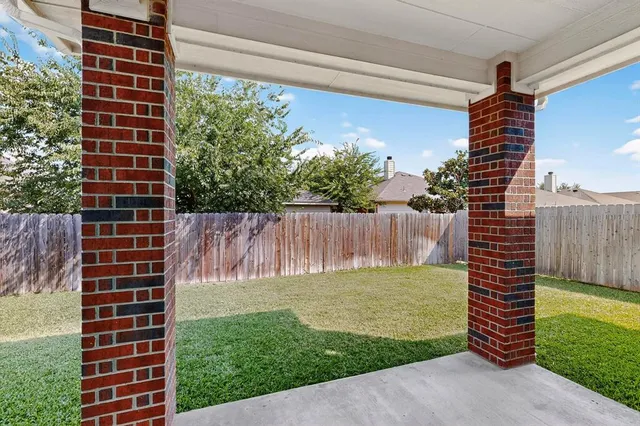a view of a backyard with a garden