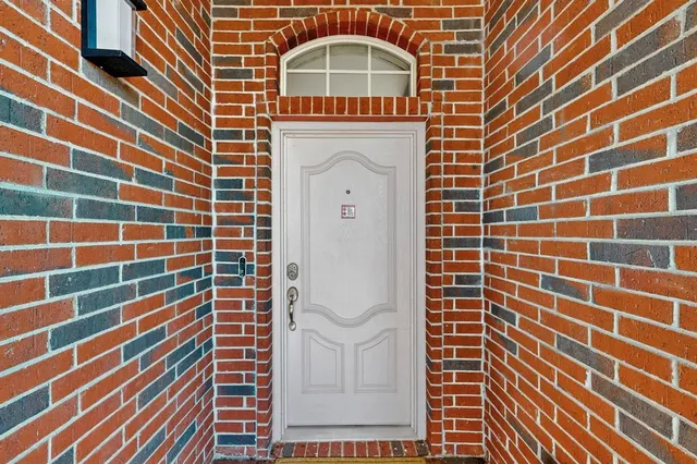 a view of a brick building with many windows