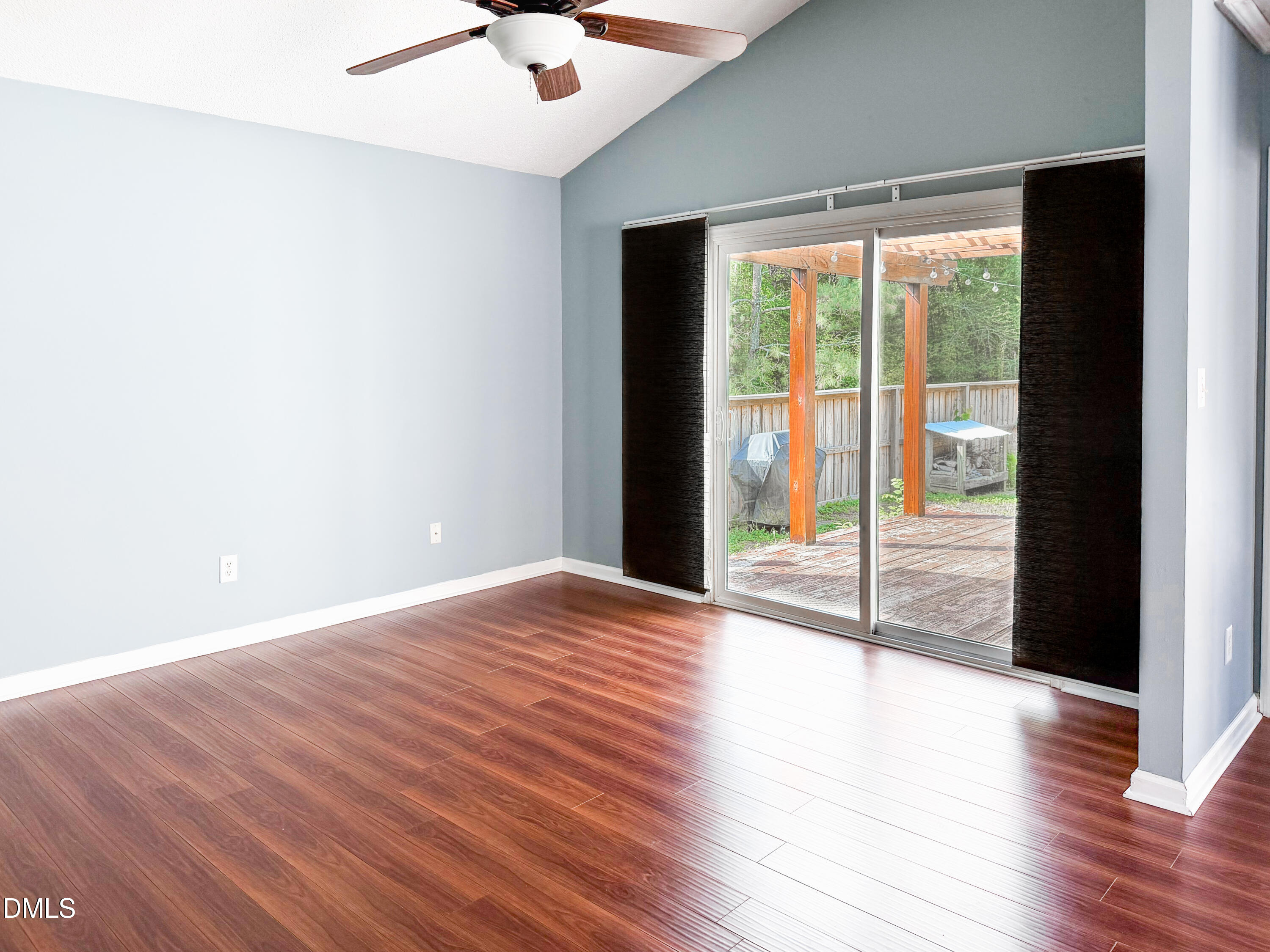 6304 Forest Ridge Drive Durham, NC 27713 - Photo 3 of 29 a view of an empty room with wooden floor and a window