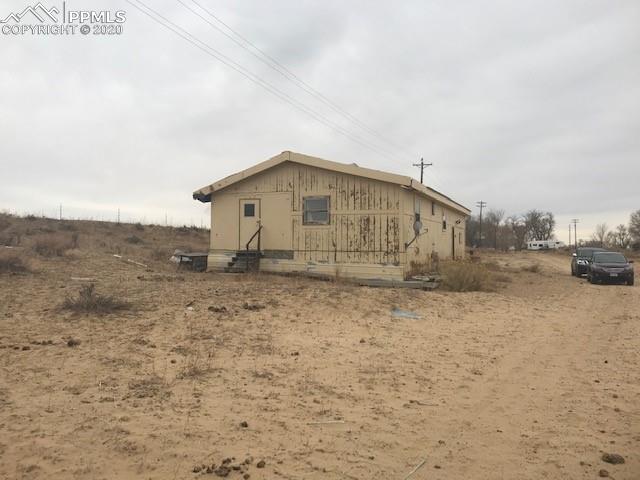 47835 Highway 96 Boone, CO 81025 - Photo 16 of 18 a view of a house with a yard