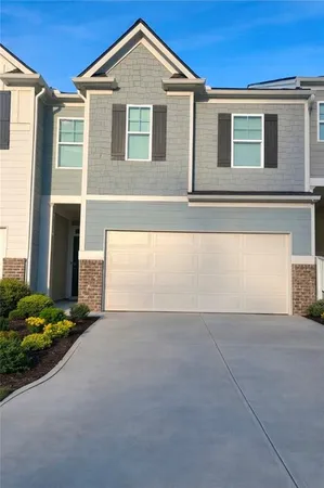 a room with wooden floor and mirror